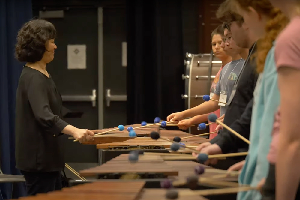 student playing xylophone